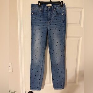 Madewell skinny jeans with black heart pattern